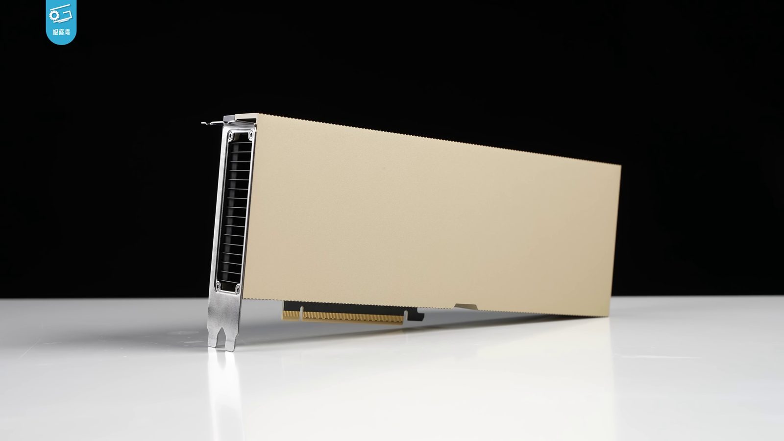 NVIDIA H100 PCIe accelerator on a table, photographed by Geekerwan