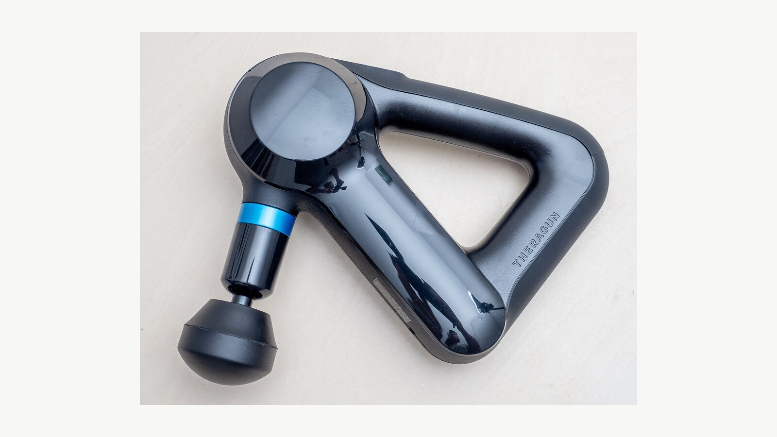 A Theragun massage device photographed in 2022